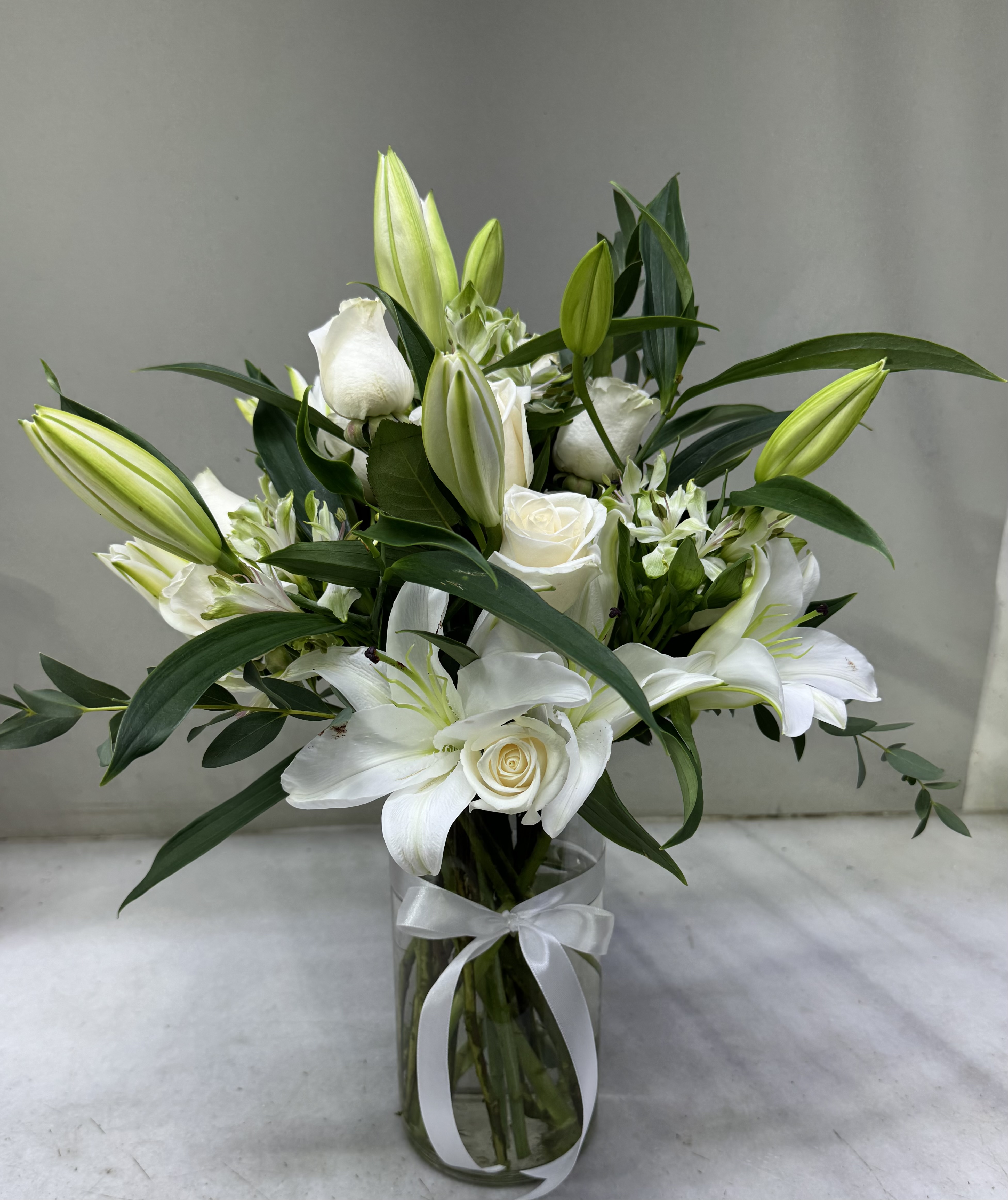 a vase of white flowers